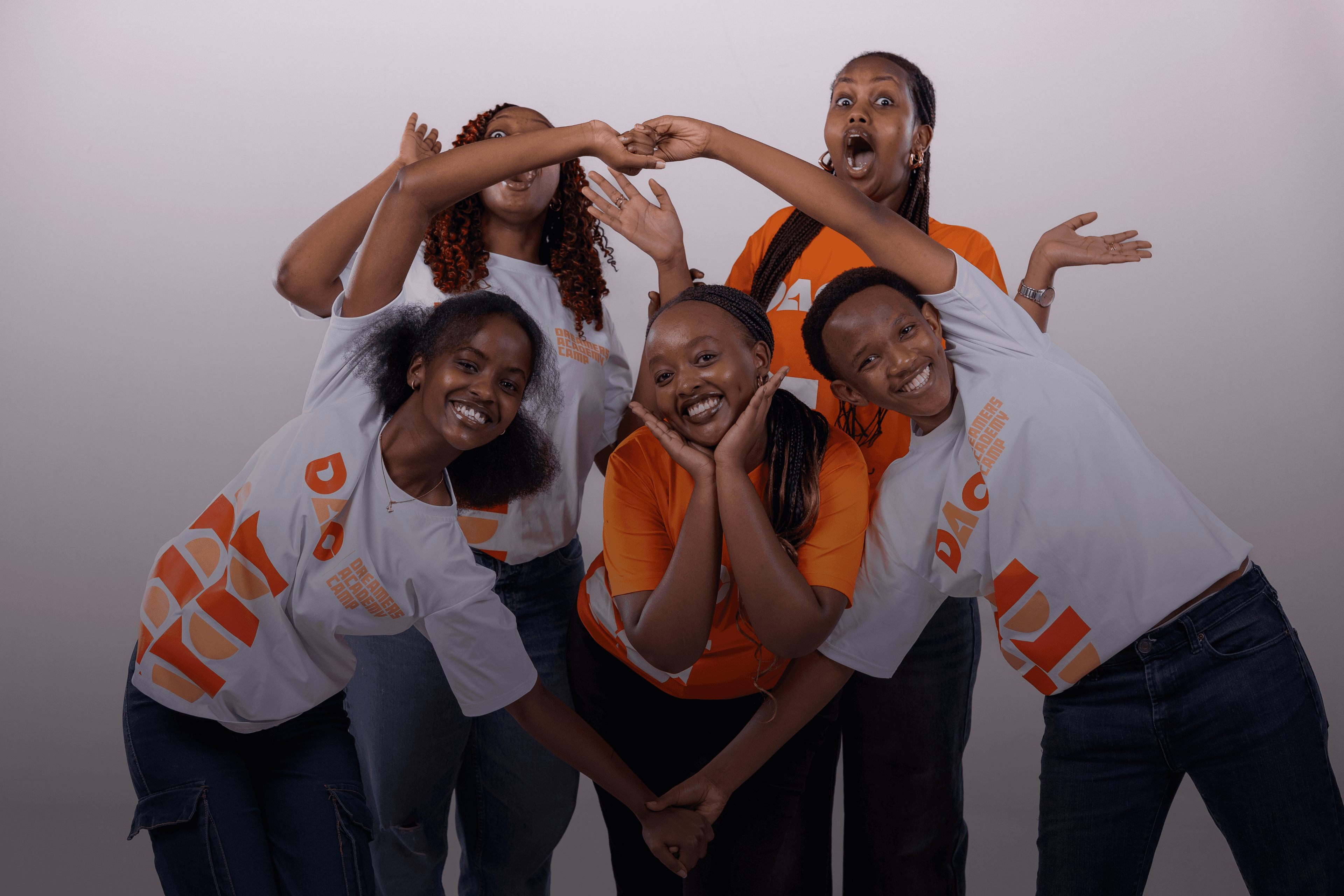 Students smiling and giving thumbs up